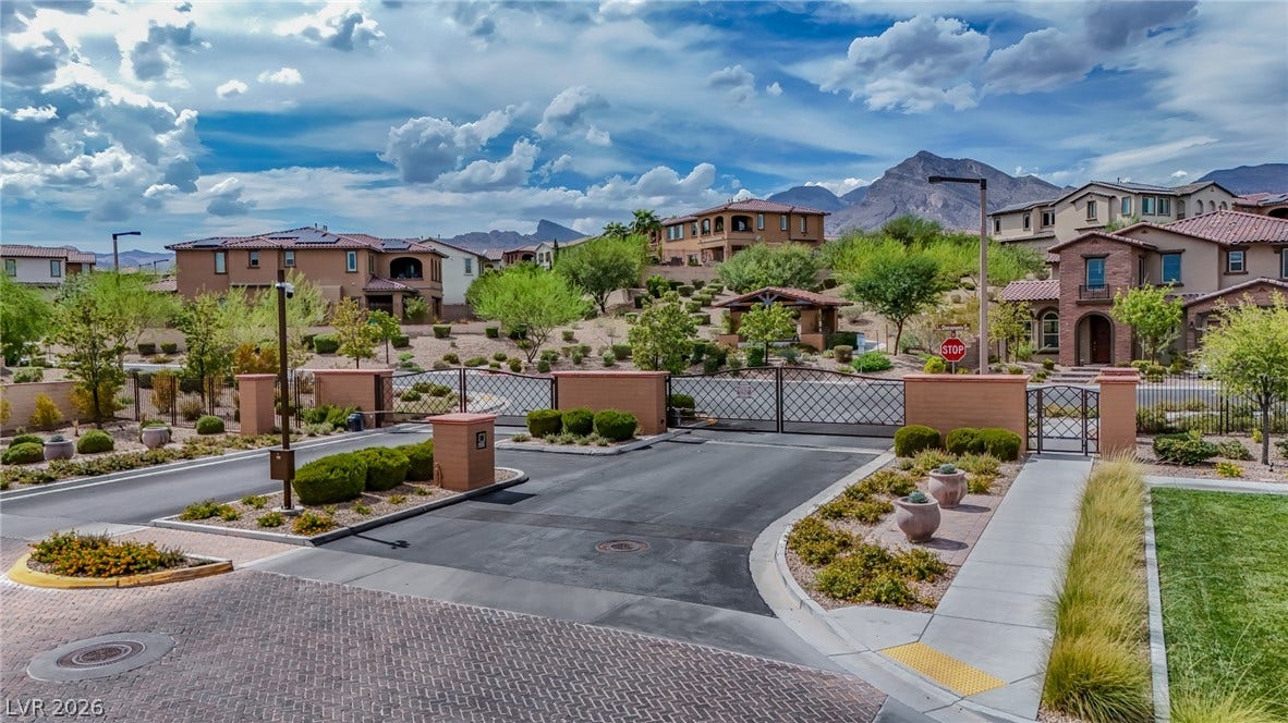 12013 Tramonto Avenue, Las Vegas, NV 89138 Dramatic mountain vistas frame the secure gated entrance of this neighborhood.