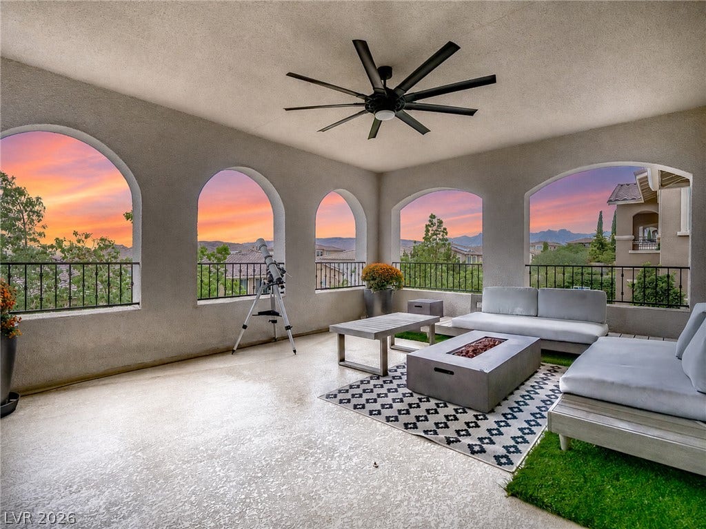 12013 Tramonto Avenue, Las Vegas, NV 89138 Arched openings frame sunset views of the surrounding hills from this covered patio.