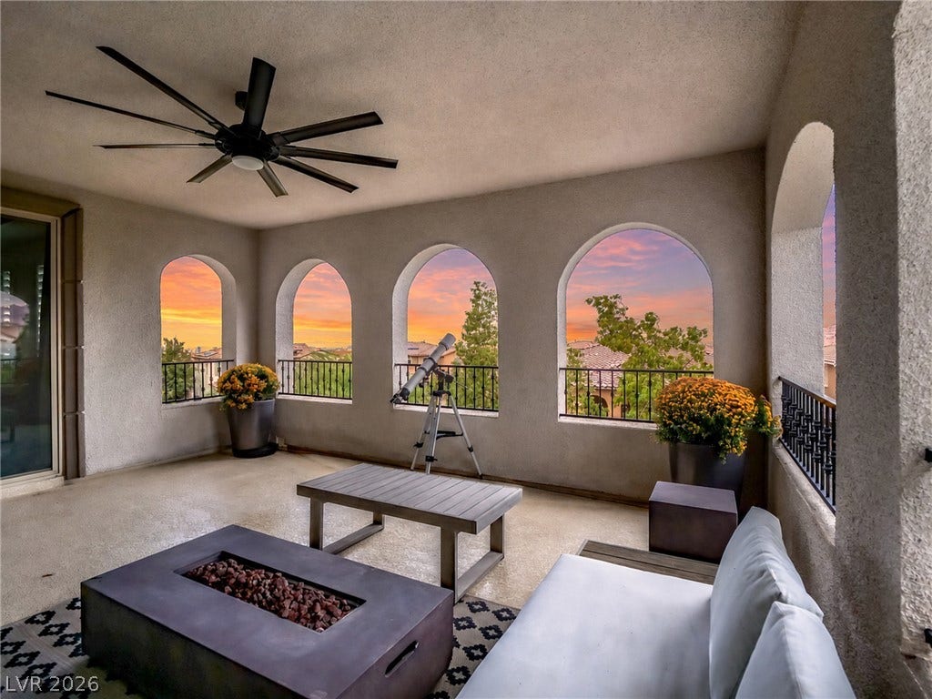 12013 Tramonto Avenue, Las Vegas, NV 89138 Elegant arched openings frame dramatic sunset views from this covered terrace.