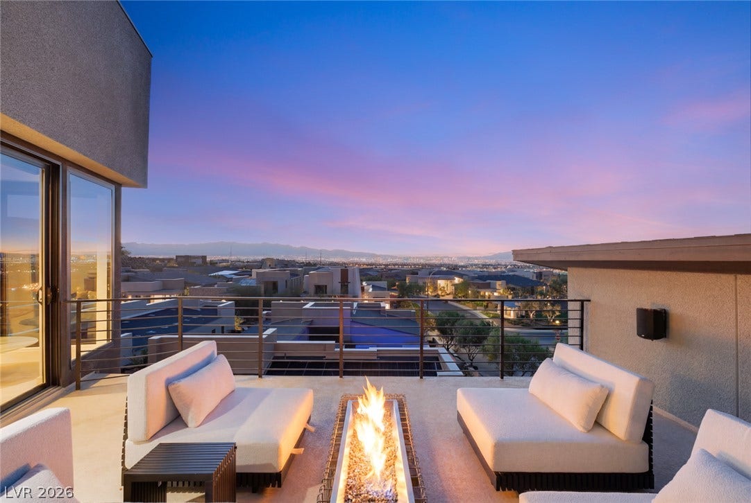2208 Overlook Canyon Lane, Henderson, NV 89052 An inviting rooftop deck boasts a linear fire pit with sweeping city and mountain views.