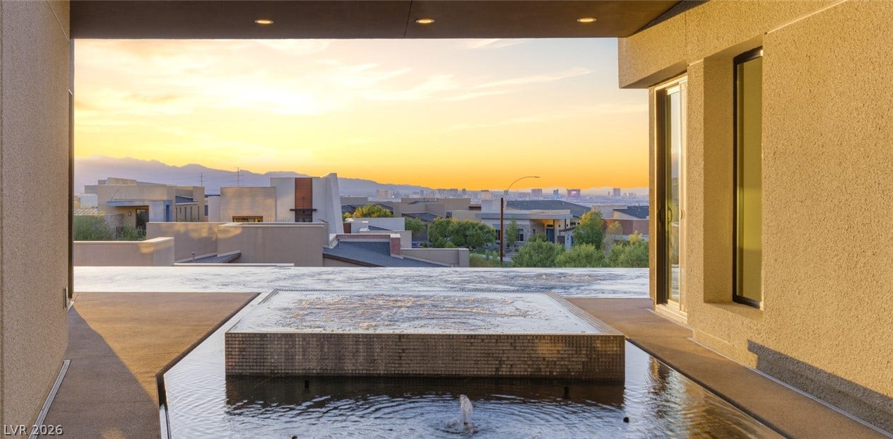 2208 Overlook Canyon Lane, Henderson, NV 89052 An exquisite outdoor space offers captivating mountain and city views at sunset.