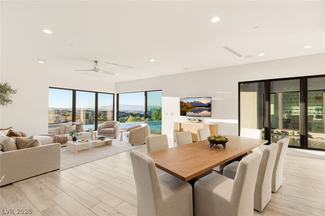 2208 Overlook Canyon Lane, Henderson, NV 89052 Floor-to-ceiling glass captures dynamic views from this open-concept living and dining area.