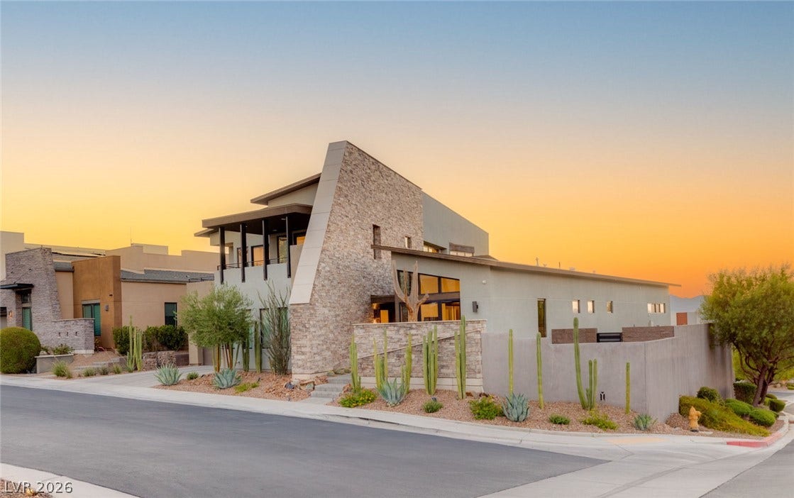 2208 Overlook Canyon Lane, Henderson, NV 89052 Architectural desert oasis featuring bold stone accents and captivating xeriscape landscaping.