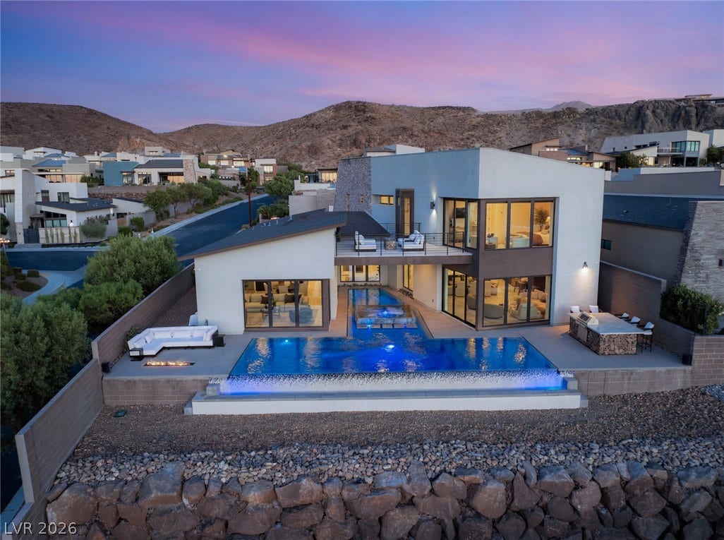 2208 Overlook Canyon Lane, Henderson, NV 89052 Dramatic modern architecture meets desert luxury with this tiered pool and integrated outdoor living spaces.