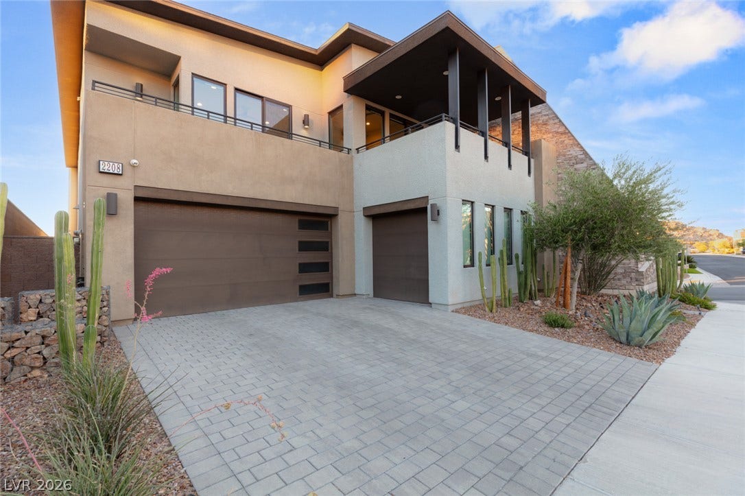 2208 Overlook Canyon Lane, Henderson, NV 89052 Modern desert architecture with a clean-lined faade and meticulously landscaped drought-tolerant plants.