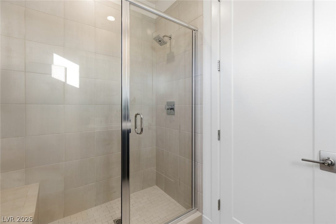 2208 Overlook Canyon Lane, Henderson, NV 89052 A frameless glass shower enclosure offers a contemporary, spa-like bathing experience.