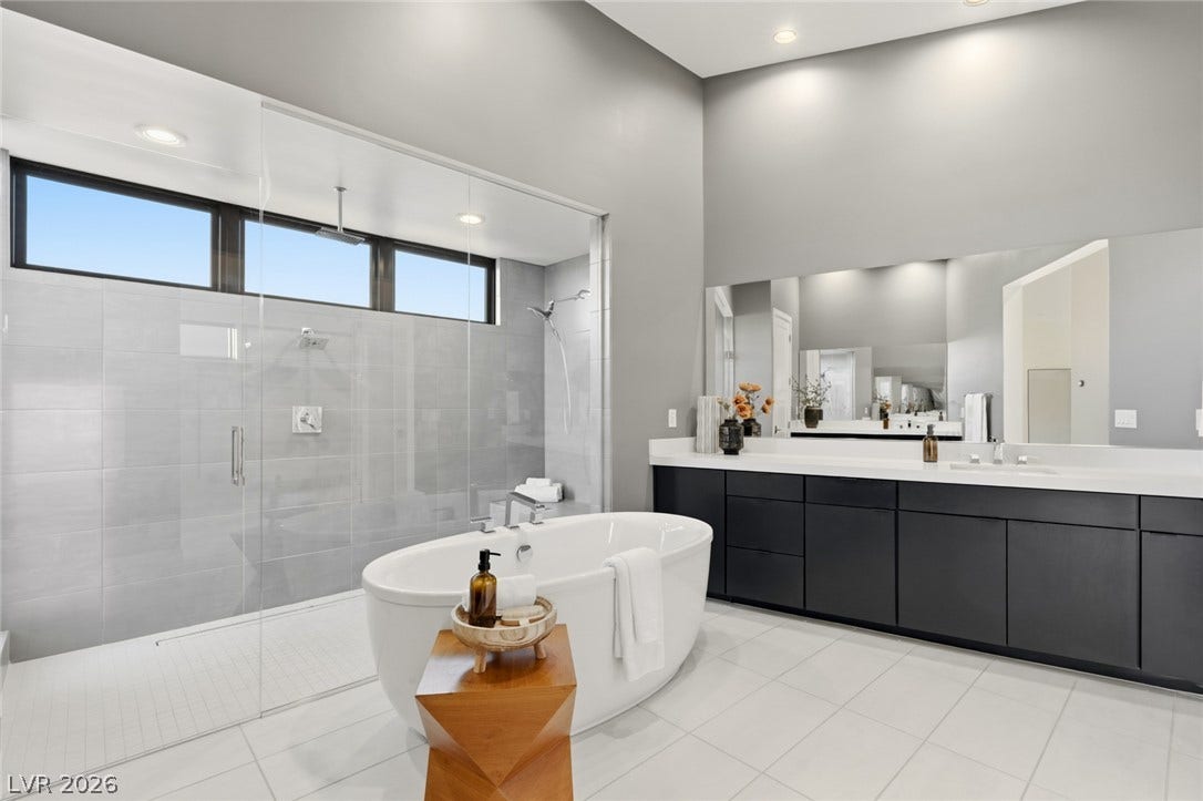 2208 Overlook Canyon Lane, Henderson, NV 89052 Indulge in a tranquil retreat with a deep soaking tub and a spacious walk-in shower.
