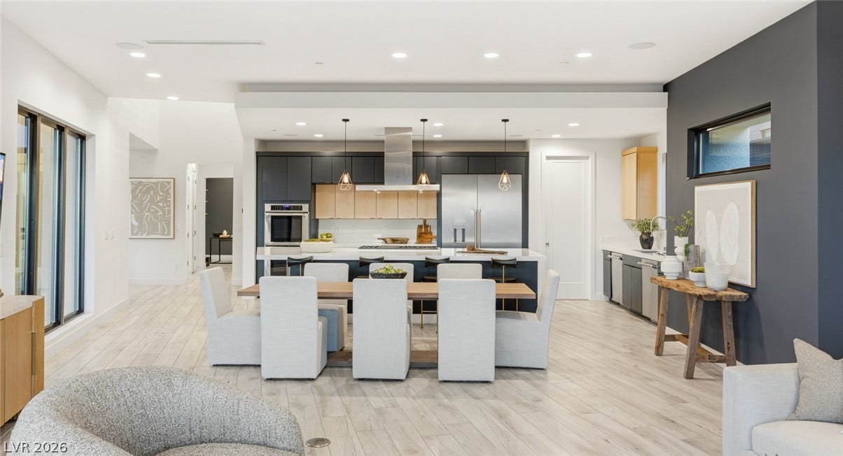 2208 Overlook Canyon Lane, Henderson, NV 89052 An open-concept living space integrates a modern kitchen and dining area with abundant natural illumination.