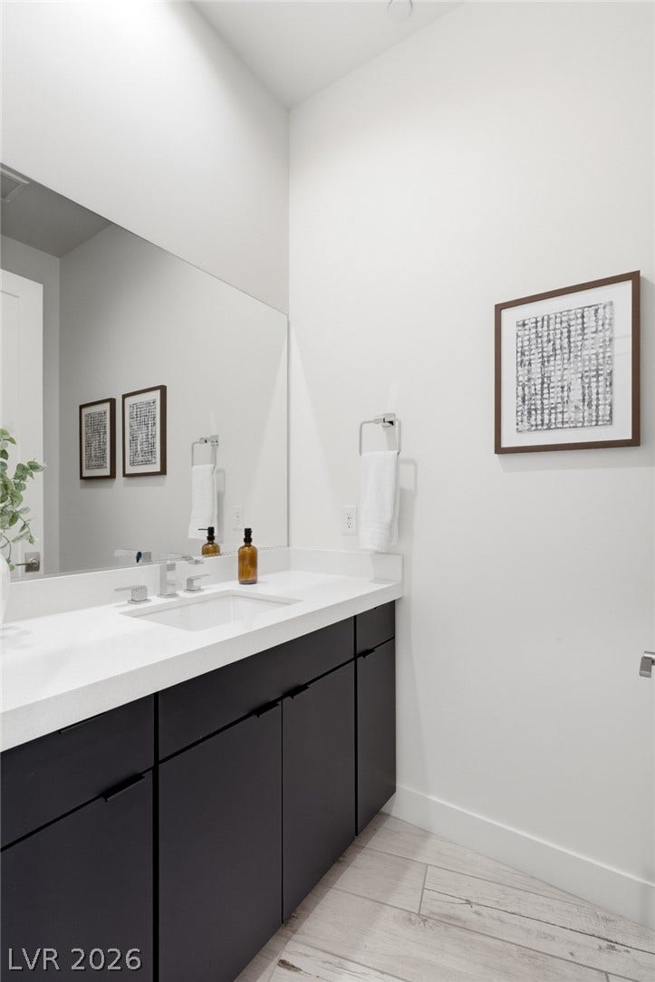 2208 Overlook Canyon Lane, Henderson, NV 89052 A sleek vanity with ample storage anchors this well-appointed bathroom, featuring modern finishes and clean lines.