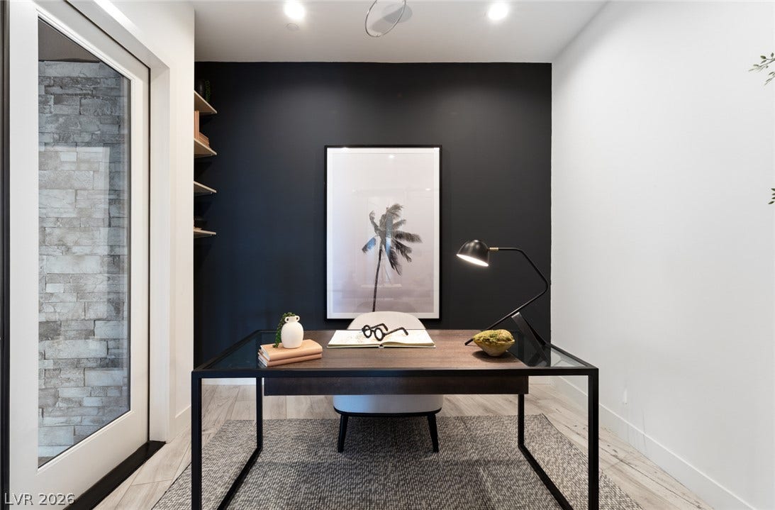 2208 Overlook Canyon Lane, Henderson, NV 89052 An inviting office space, thoughtfully designed with recessed lighting and built-in shelving, offers a peaceful work environment.