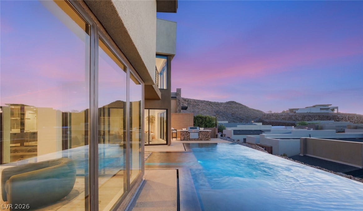 2208 Overlook Canyon Lane, Henderson, NV 89052 Infinity pool and outdoor kitchen complement this modern desert home with majestic mountain views.