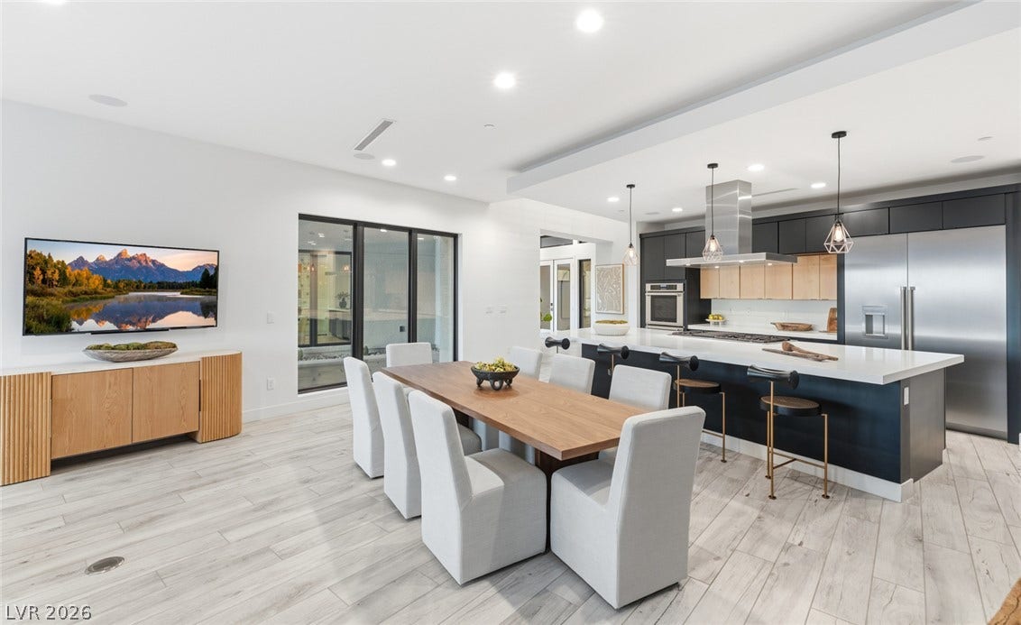 2208 Overlook Canyon Lane, Henderson, NV 89052 An open concept kitchen and dining space showcases streamlined design with modern finishes.