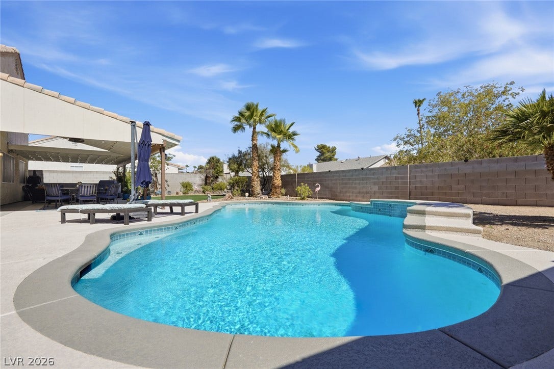 206 Oleander Place, Henderson, NV 89015 An inviting backyard oasis offers a sparkling pool and spa with ample space for relaxation.