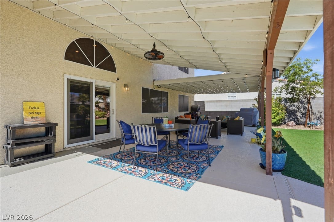 206 Oleander Place, Henderson, NV 89015 An inviting covered patio offers a relaxing outdoor living space, perfect for al fresco dining and entertaining.