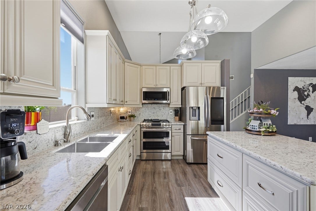 206 Oleander Place, Henderson, NV 89015 Culinary creations come to life in this kitchen, featuring ample countertop space and contemporary appliances.