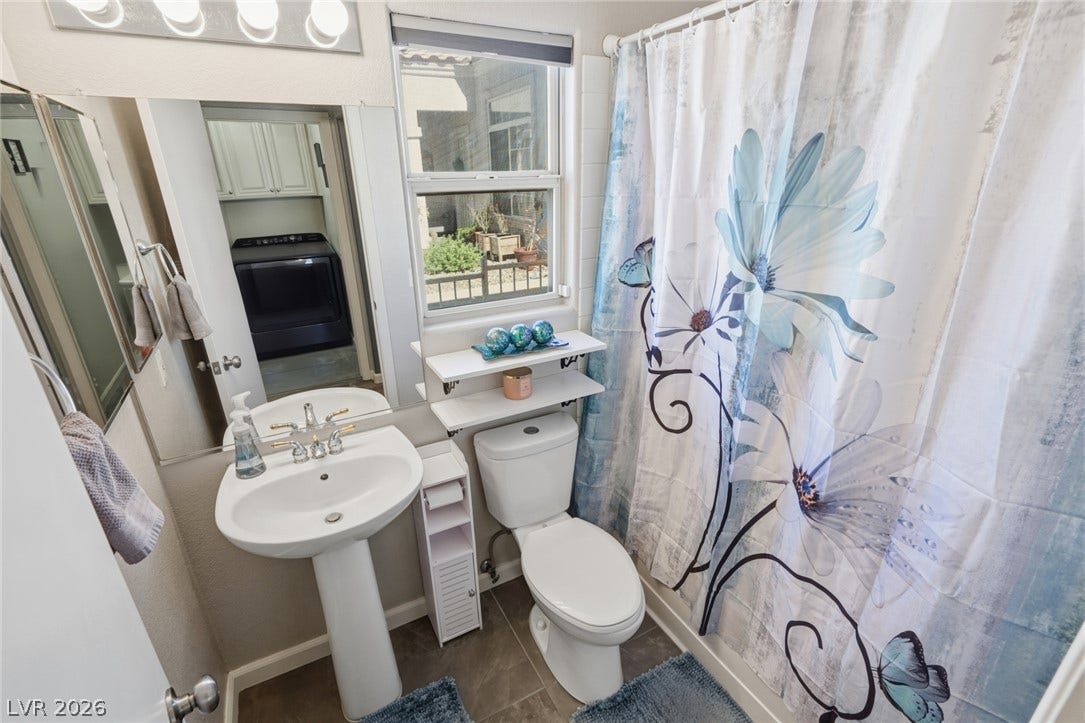 206 Oleander Place, Henderson, NV 89015 Functional full bathroom featuring a pedestal sink and tile flooring, ready for daily routines.