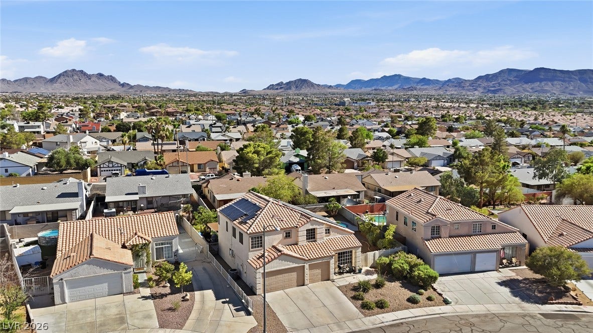 206 Oleander Place, Henderson, NV 89015 An aerial perspective reveals a vibrant neighborhood with mountain views.