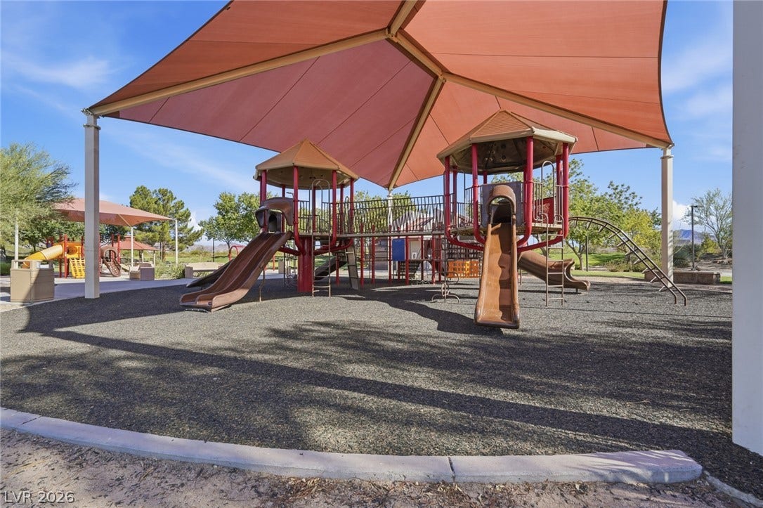 206 Oleander Place, Henderson, NV 89015 A vibrant community playground features robust play structures and protective shading.