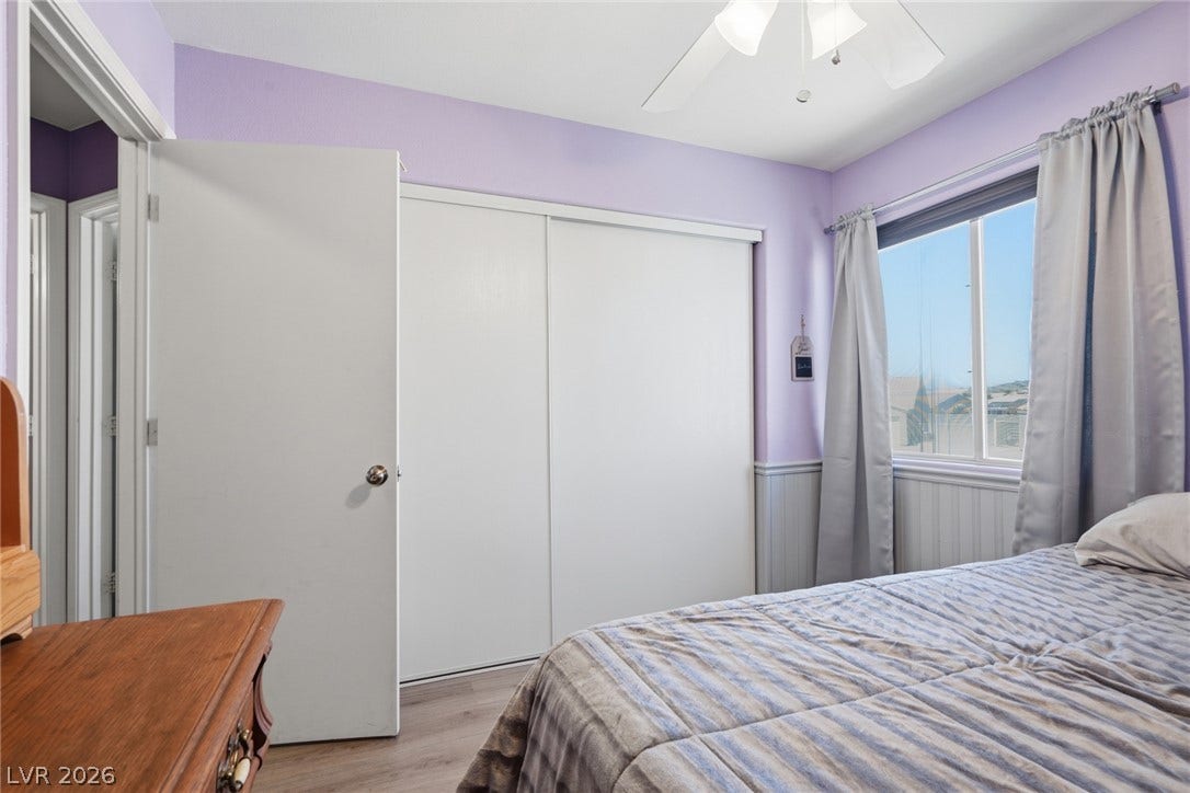 206 Oleander Place, Henderson, NV 89015 Ample closet space and a window with natural light define this cozy sleeping quarter.