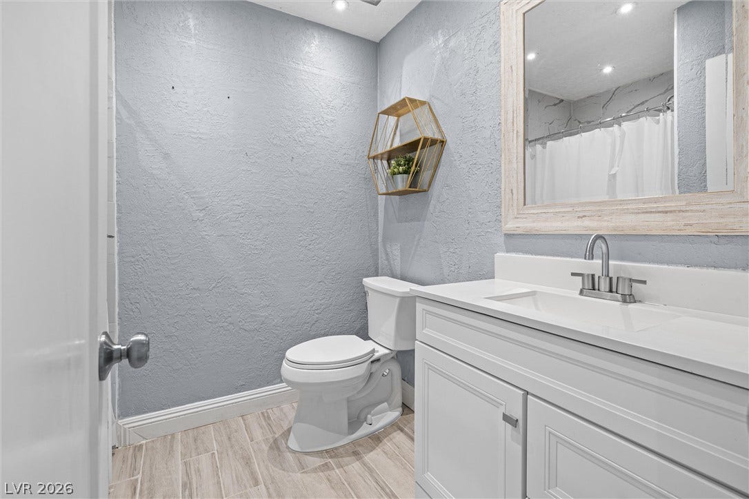 3303 Royce Court, Las Vegas, NV 89121 A pristine powder room featuring a sleek vanity and modern fixtures.