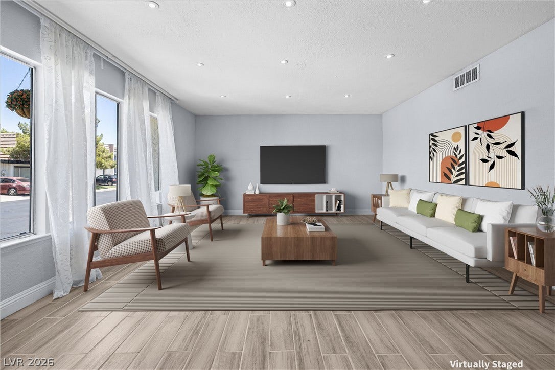 3303 Royce Court, Las Vegas, NV 89121 Sun-filled living area features abundant natural light, recessed lighting, and stylish tile flooring.