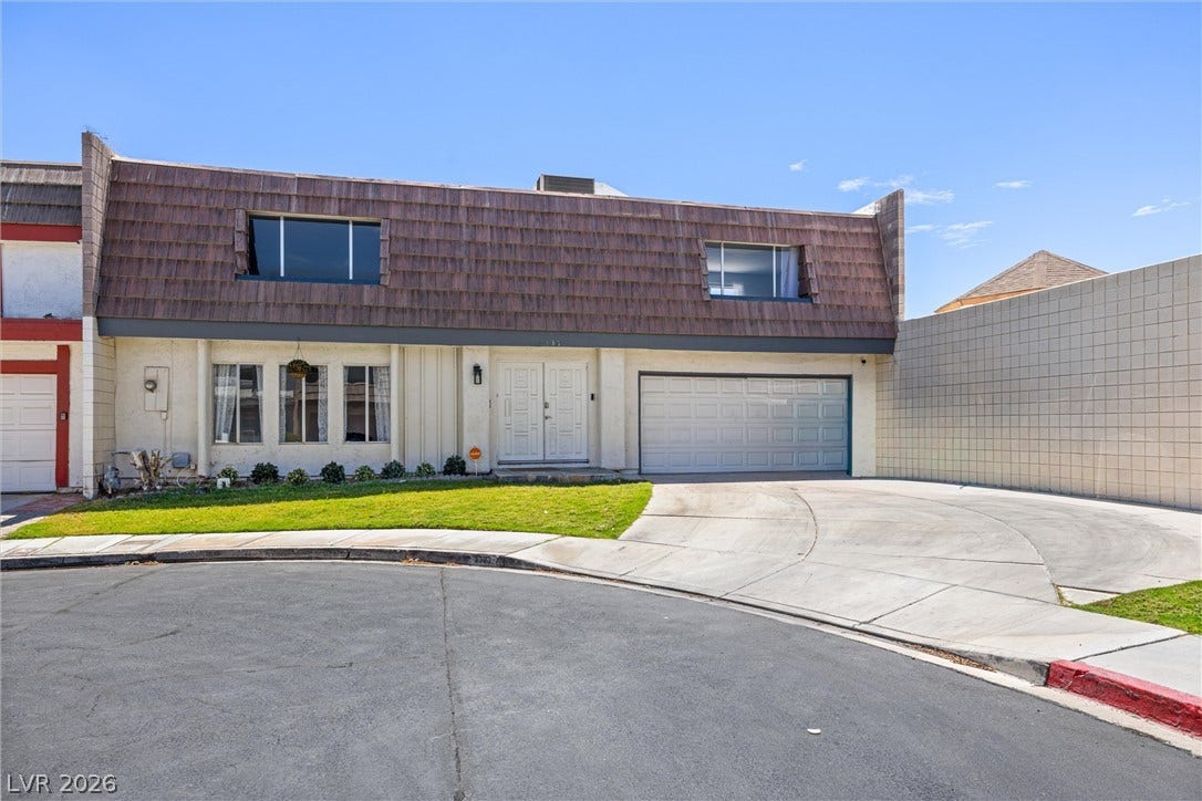 3303 Royce Court, Las Vegas, NV 89121 A well-maintained facade with a private driveway leads to this charming residence.
