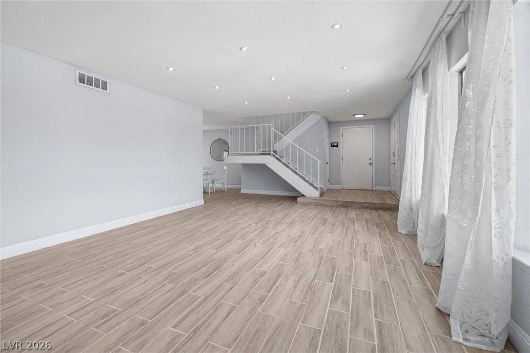 3303 Royce Court, Las Vegas, NV 89121 Enter into a bright, open living space featuring wood-look tile flooring and recessed lighting.