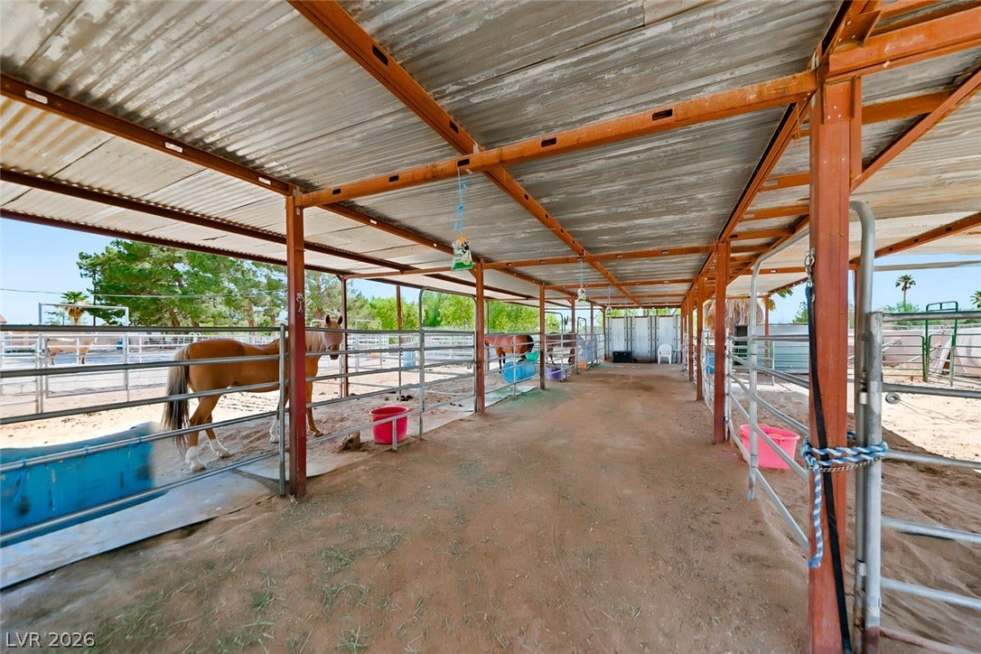 Robust metal construction, providing shelter and secure enclosures for equestrian care.