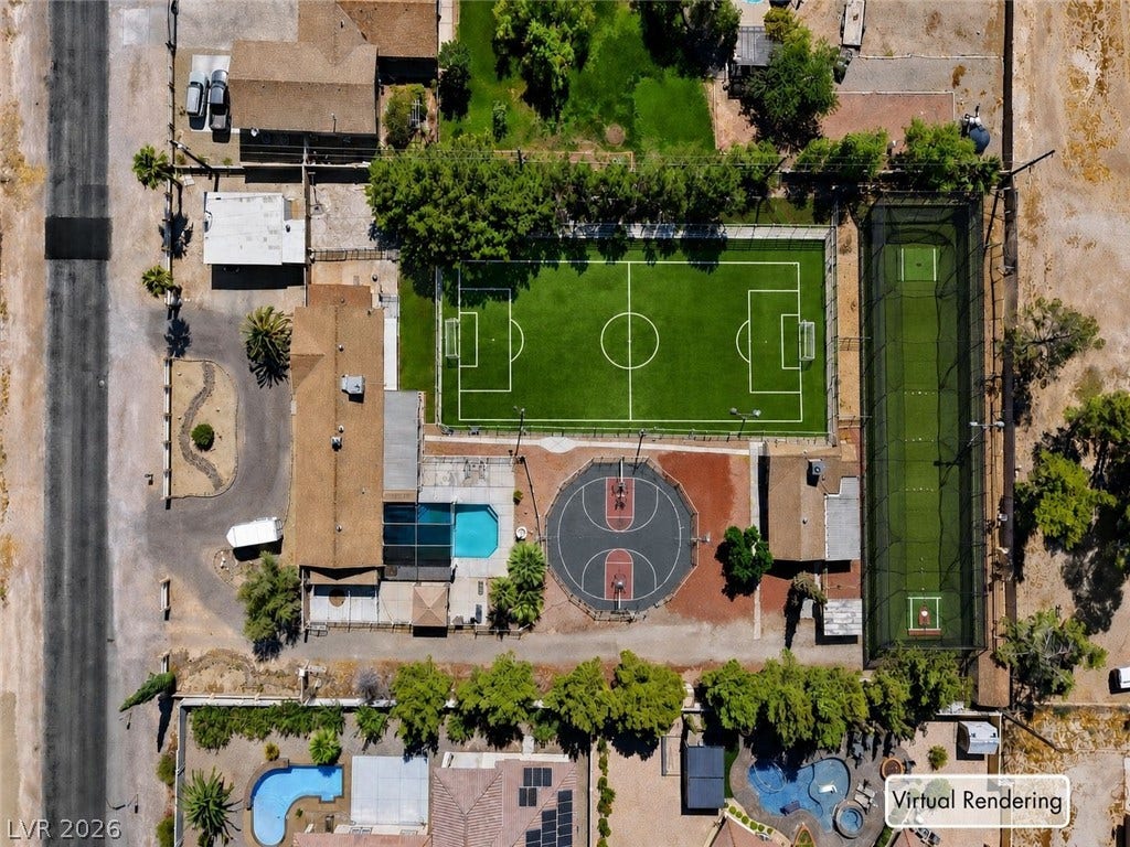 An aerial perspective showcases an expansive array of private backyard athletic facilities.