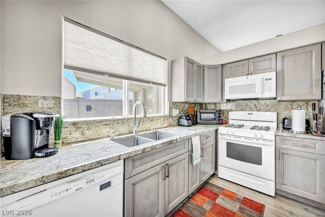 Culinary delights await in this modern kitchen with ample counter space and convenient appliances.