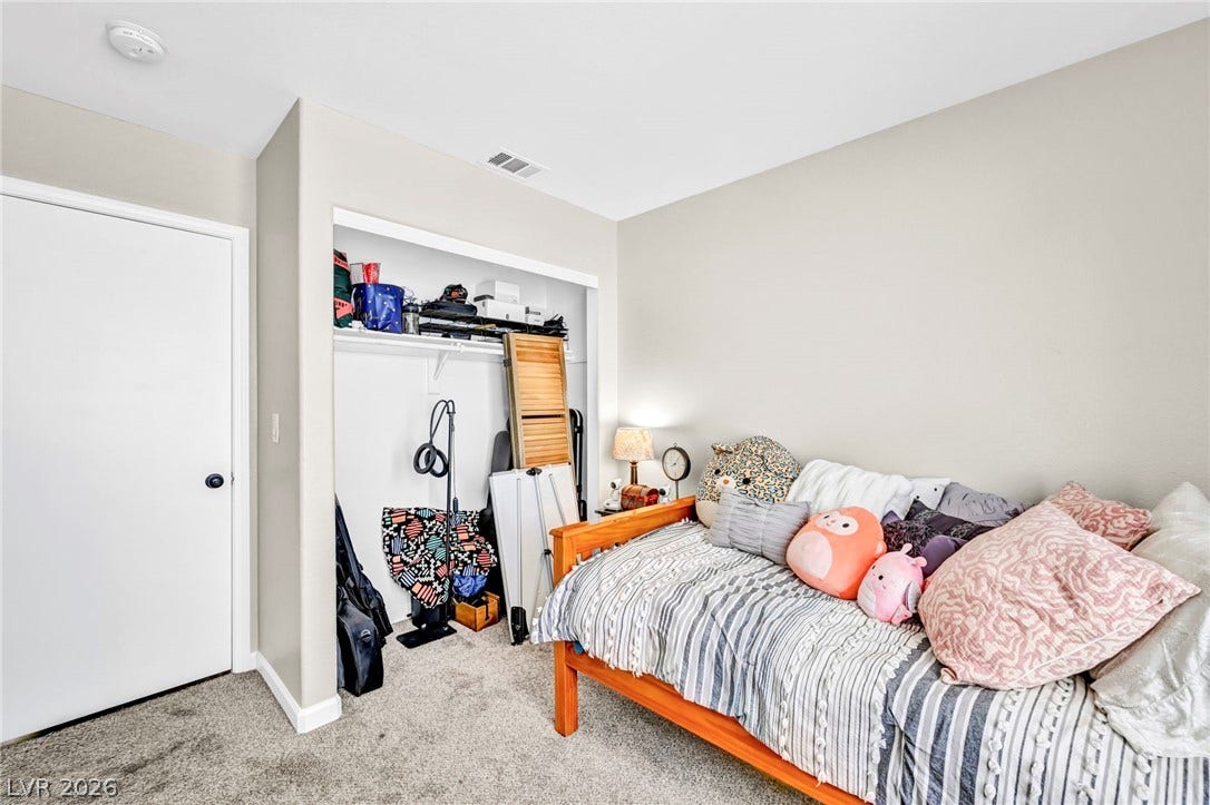 Comfortable bedroom featuring a cozy bed and convenient closet space.