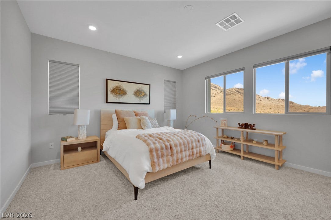 11572 Desert Hollow Avenue, Las Vegas, NV 89138 Discover a tranquil bedroom retreat with expansive desert mountain views and recessed lighting.
