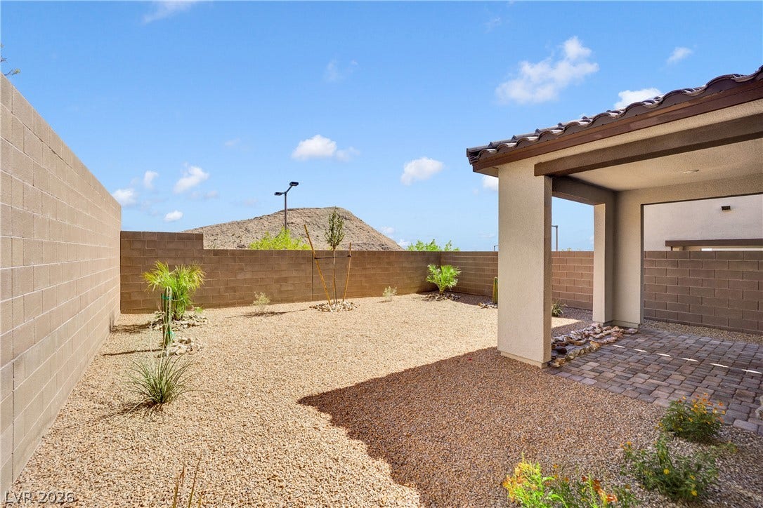 11572 Desert Hollow Avenue, Las Vegas, NV 89138 A low-maintenance desert oasis awaits, featuring a covered patio and xeriscaped yard.