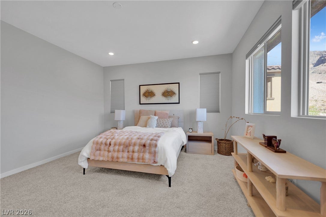 11572 Desert Hollow Avenue, Las Vegas, NV 89138 Sun-filled bedroom featuring soft carpeting and bright recessed lighting.