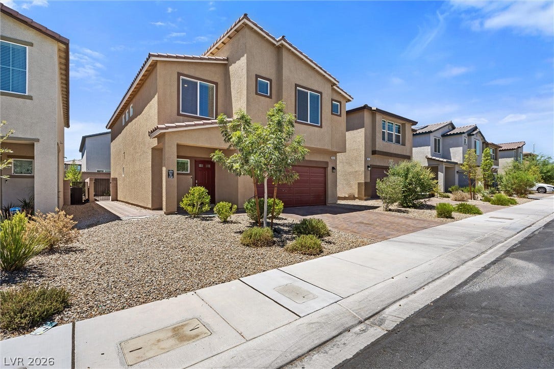 8943 Pelican Point Street, Las Vegas, NV 89178 A welcoming contemporary exterior showcases desert landscaping and a convenient attached garage.