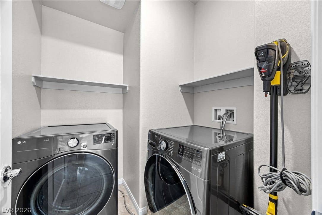 8943 Pelican Point Street, Las Vegas, NV 89178 Functional laundry nook with shelving for convenience, ready for your appliances.