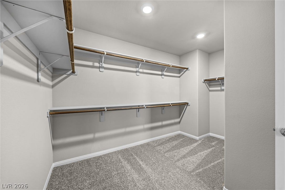 8943 Pelican Point Street, Las Vegas, NV 89178 Ample storage solutions abound in this well-appointed closet, featuring generous shelving and hanging rods.