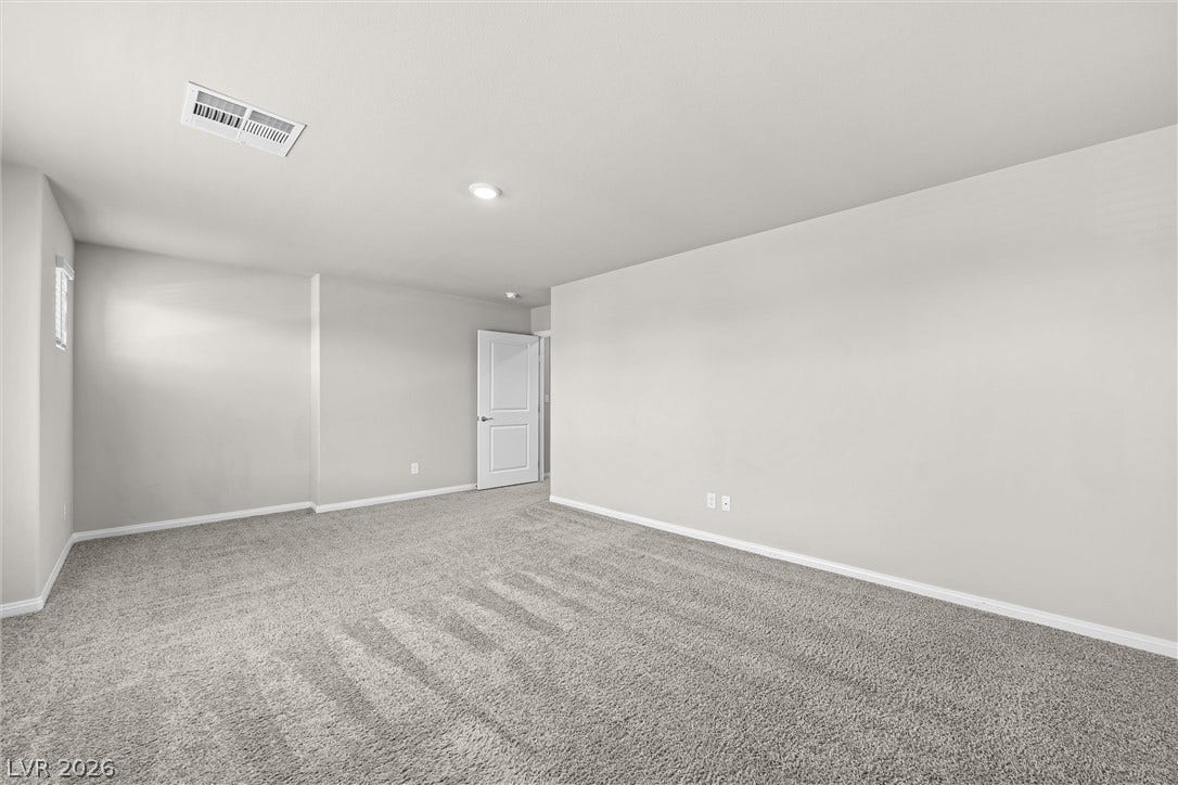 8943 Pelican Point Street, Las Vegas, NV 89178 Well-lit and spacious, this room provides a blank canvas for personalized interior design.
