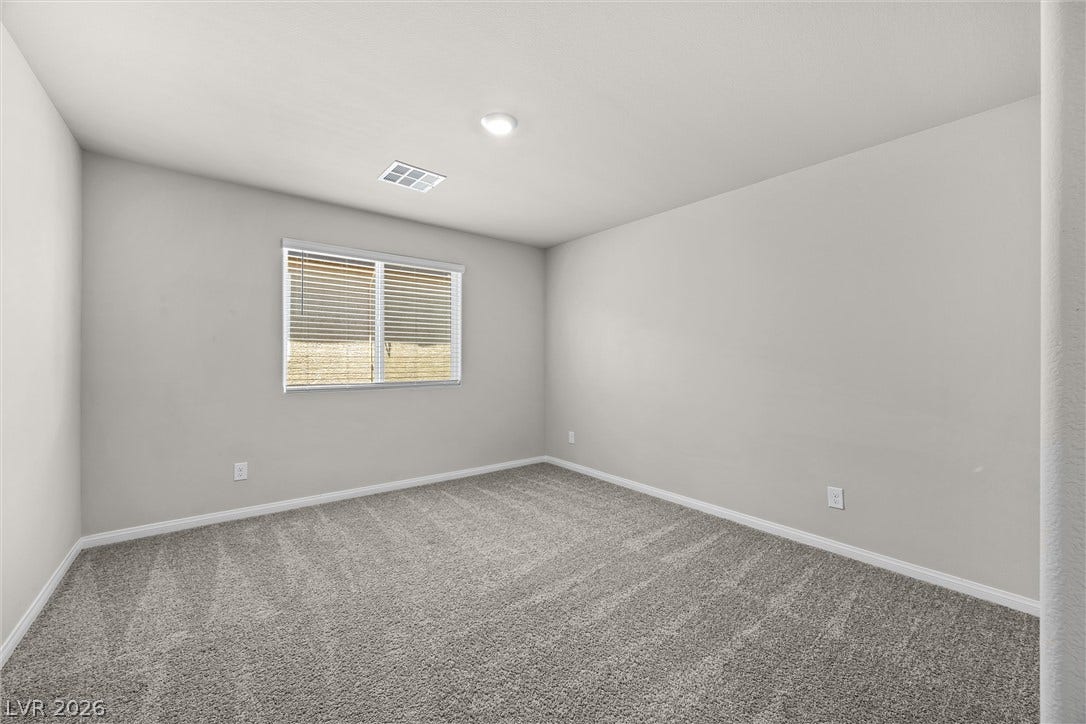 8943 Pelican Point Street, Las Vegas, NV 89178 A well-lit, neutral room provides a blank canvas for personalization.
