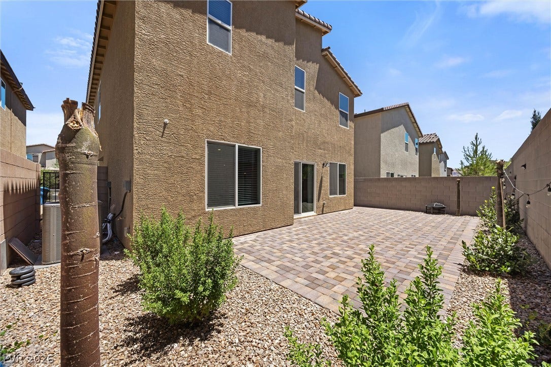 8943 Pelican Point Street, Las Vegas, NV 89178 A private backyard oasis features extensive paver patio, ideal for outdoor enjoyment and minimal landscaping upkeep.