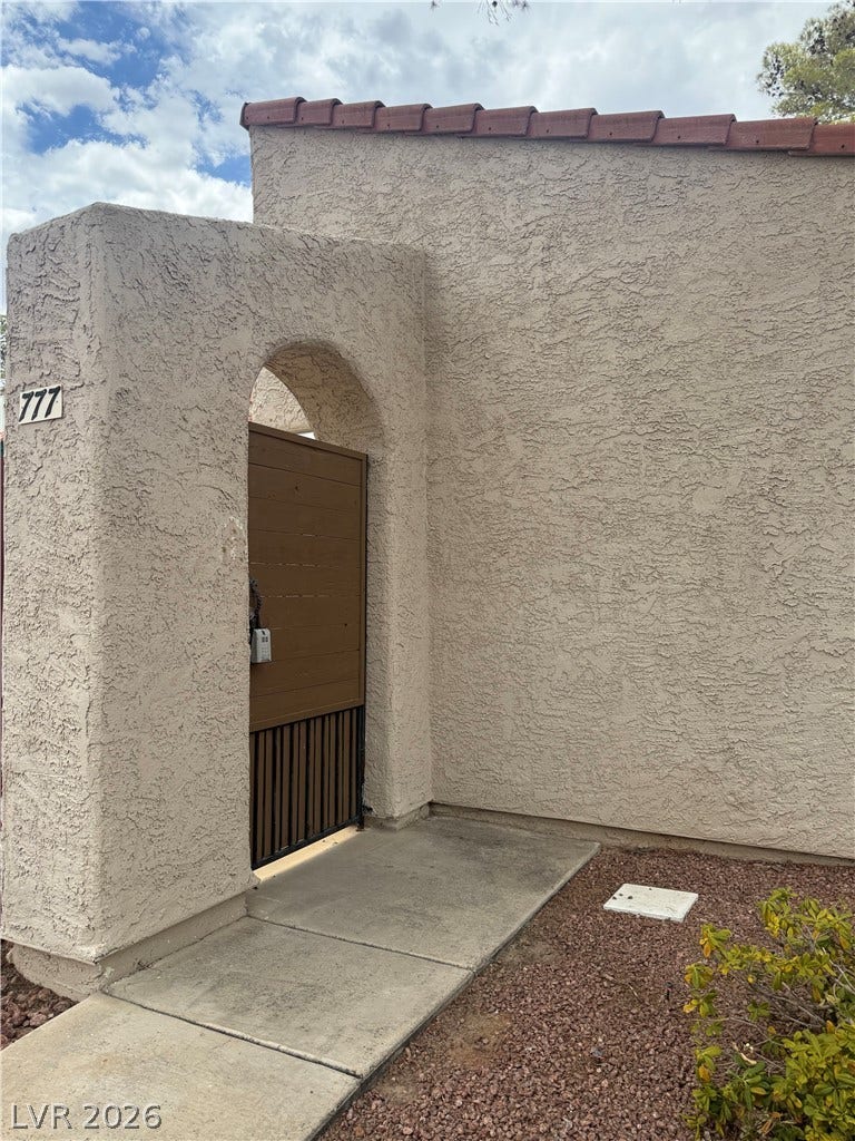 An inviting gated entry creates a private courtyard approach to this distinctive residence.