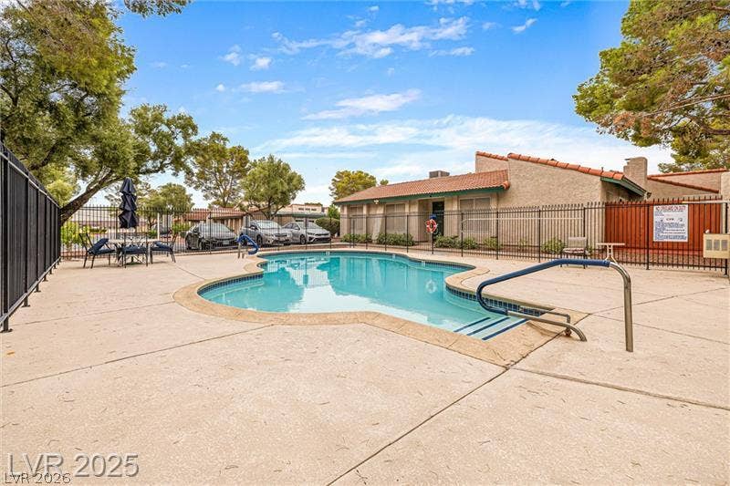 An inviting community pool with ample patio space awaits for refreshing swims.