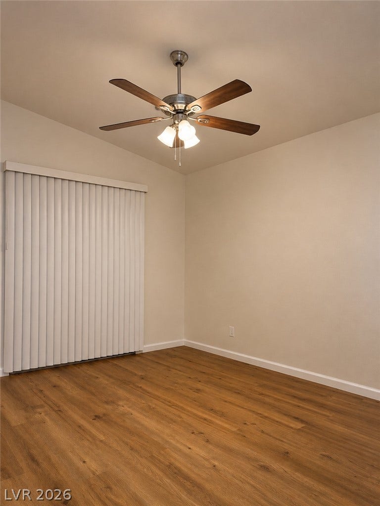 Natural wood flooring complements the room, offering an ideal setting for relaxation.