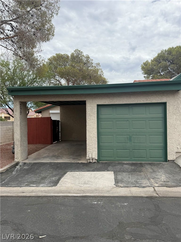 Functional garage and carport provide convenient covered parking options.