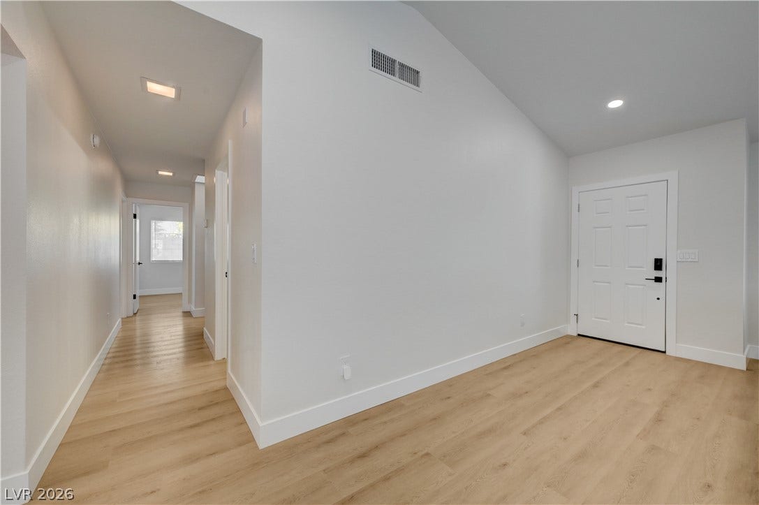 3131 White Rose Way, Henderson, NV 89014 Clean lines and a light wood-look floor welcome you into this inviting entryway.