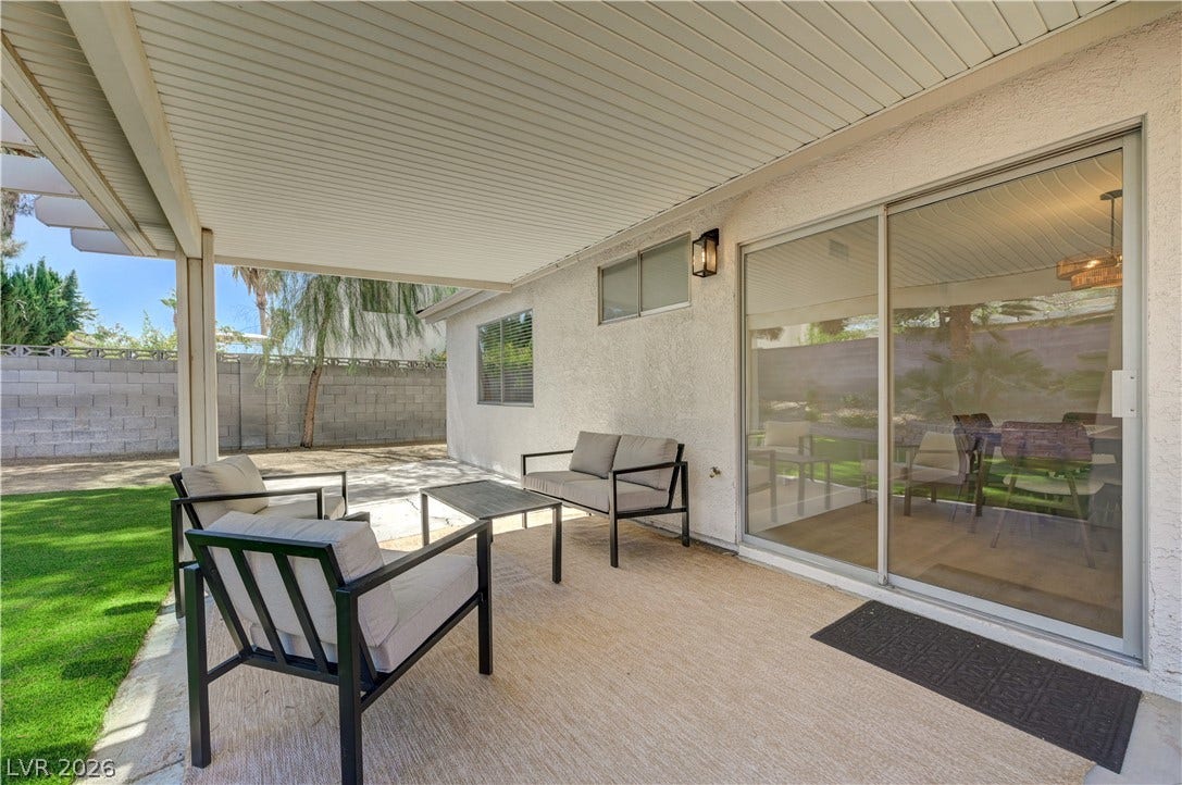 3131 White Rose Way, Henderson, NV 89014 A spacious covered patio provides an ideal setting for outdoor relaxation and entertaining.