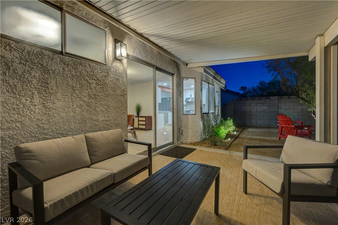 3131 White Rose Way, Henderson, NV 89014 An inviting covered patio provides a private outdoor retreat with ample space for relaxation.