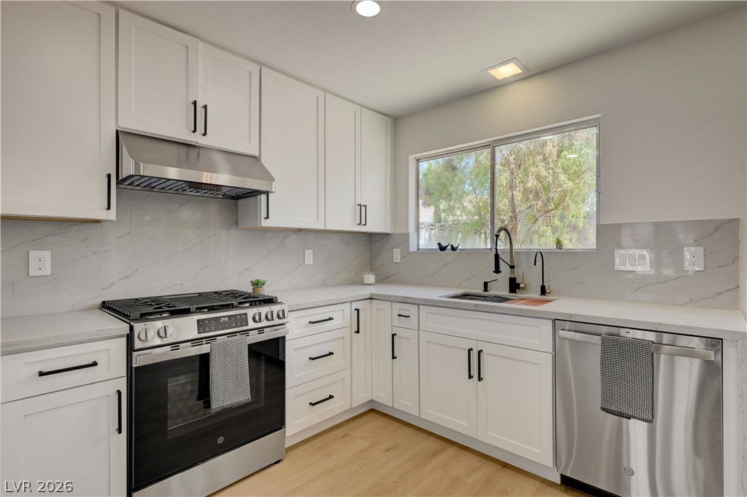 3131 White Rose Way, Henderson, NV 89014 A well-appointed kitchen features stainless steel appliances and abundant natural illumination through a spacious window.