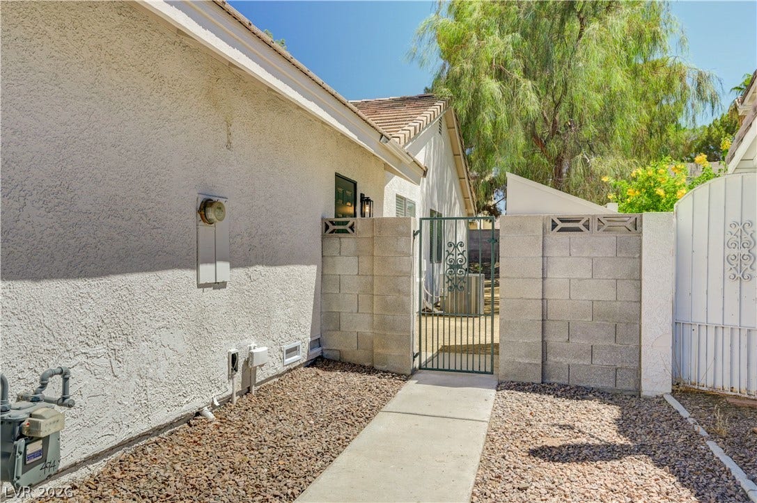 3131 White Rose Way, Henderson, NV 89014 Secure gated entry welcomes you to this meticulously maintained residence, perfect for privacy and convenience.