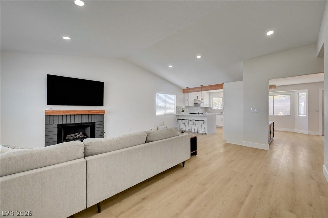 3131 White Rose Way, Henderson, NV 89014 A seamless flow connects the living area with a sleek, open-concept kitchen.